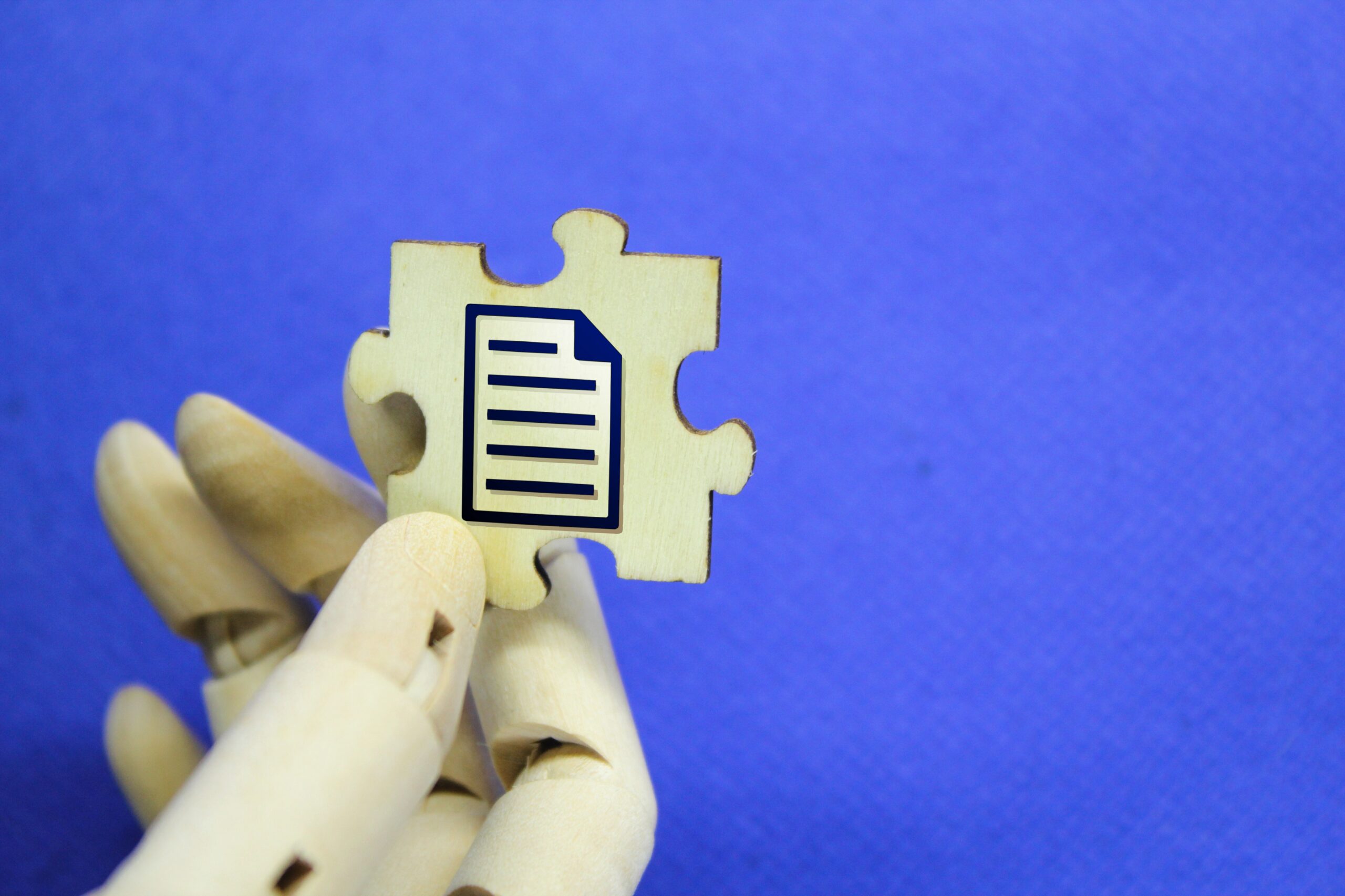 hand-holding-wooden-puzzle-with-file-icon-2025-03-09-22-09-14-utc