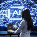 Programmer analyzing complex AI brain models on laptop, running simulations