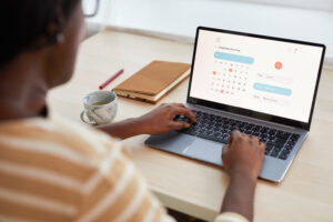 Young African-American Woman Using Time Managing App
