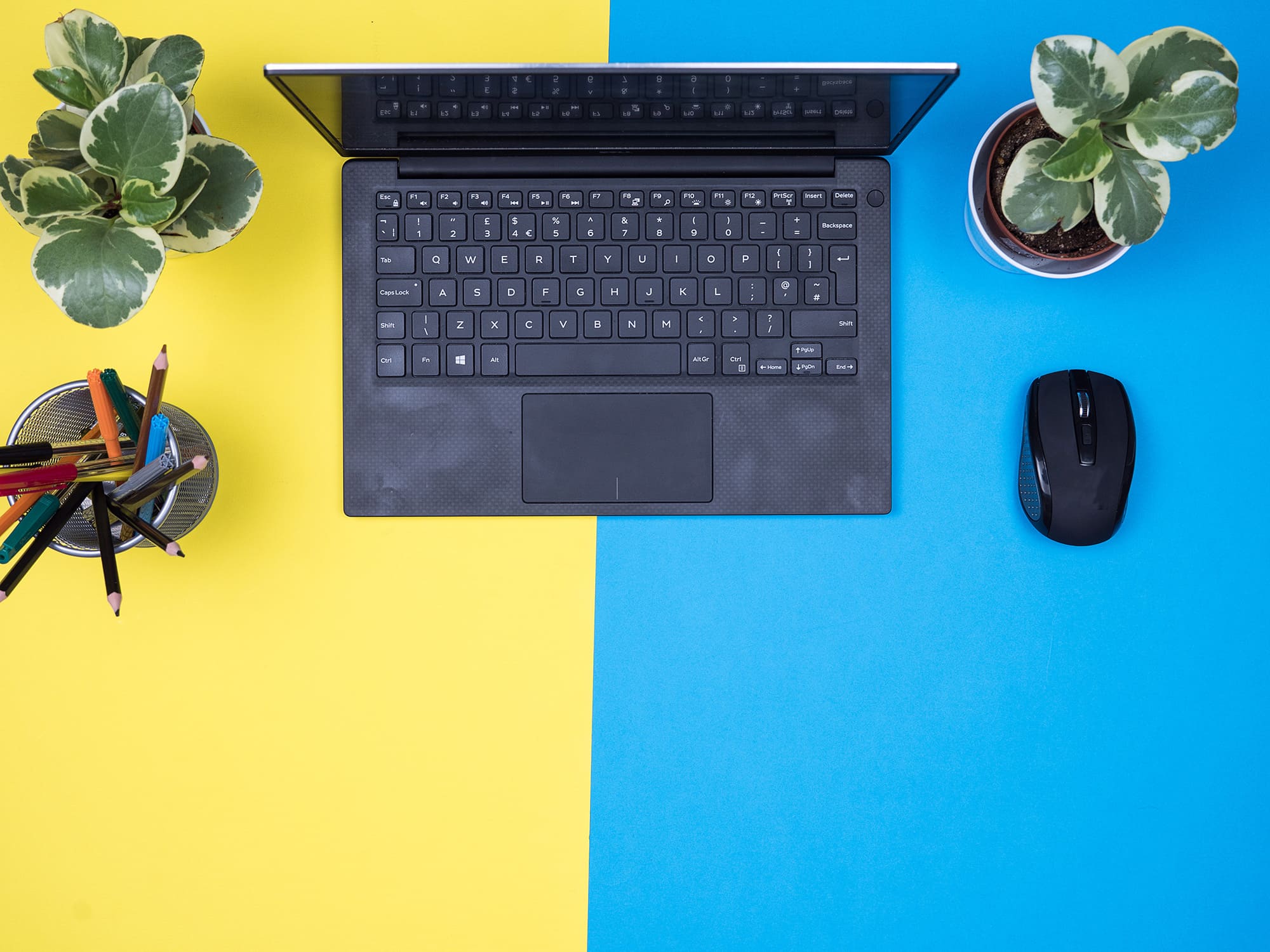 flat-lay-top-view-of-modern-notebook-over-blue-bac-2025-02-17-06-30-36-utc